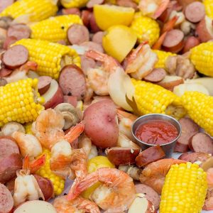 Classic seafood boil with shrimp, corn, sausage, and potatoes.